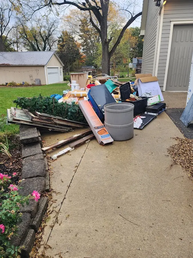 Dumpster being loaded with debris for 3 Yard Dumpster Rental in Crystal City